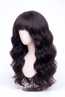 Body Wave Fringe Layered Glueless Human Hair Wig Showing the Fringe and Defined Texture by Kora Strand