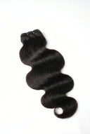 Body Wave Sew-In Bundle Showing the Defined Hair Texture by Kora Strand