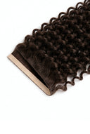 Deep Curl Seamline Weft Tape Extensions in Virgin Human Hair with Flexible Weft and Discreet Tape Construction by Kora Strand