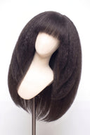 Kinky Straight Fringe Layered Glueless Human Hair Wig Showing the Fringe and Defined Texture by Kora Strand