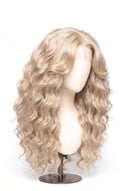 Loose Wave Layered Glueless Human Hair Wig in Shade 60 Ecru Pearl, Frosted Ash Beige Blonde, by Kora Strand